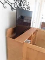 DIY cabinet with faux back hiding the TV lift mechanism 5