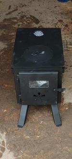 Broken front glass, but nice stove otherwise. 4