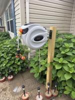Hangs up easy; and hose retracts back with ease 5