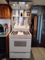 Great solution to an organized and easy to clean surface behind the cooktop. 5